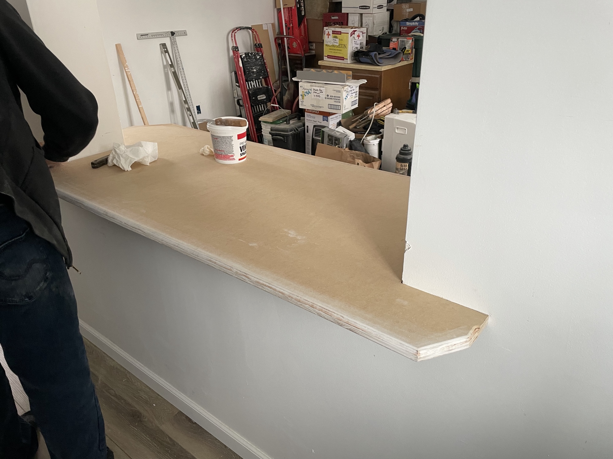 Custom built countertop shelf installed in home workspace